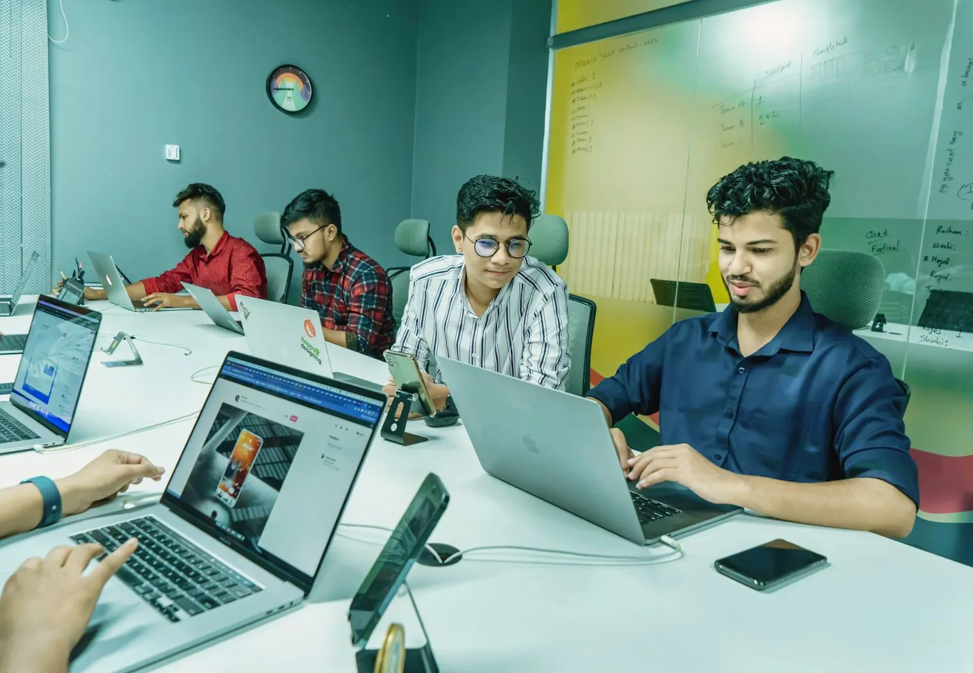 A team at work on laptops in an office